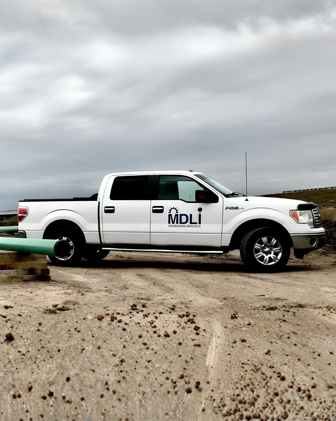 MDLI Consulting Services fleet truck at a construction project site